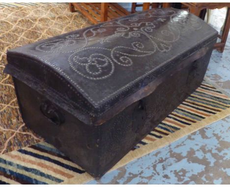 DOMED TRUNK, 18th century Continental black leather with studded decoration and a handle to each side, 115cm W x 50cm H x 58c