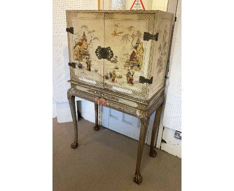 COCKTAIL CABINET, circa 1920, Queen Anne style cream lacquer and Chinoiserie decorated with two doors enclosing a glass shelf