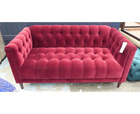 SOFA, of slight proportions, burgundy red upholstery, buttoned back finish, 150cm W.