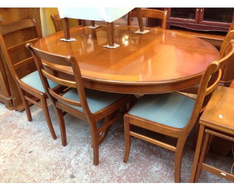 A MODERN EXTENDNING DINING TABLE AND 6 LADDER BACK CHAIRS