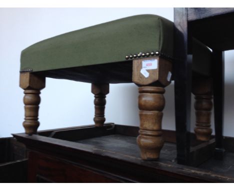 A GREEN CLOTH UPHOLSTERED POUFFE