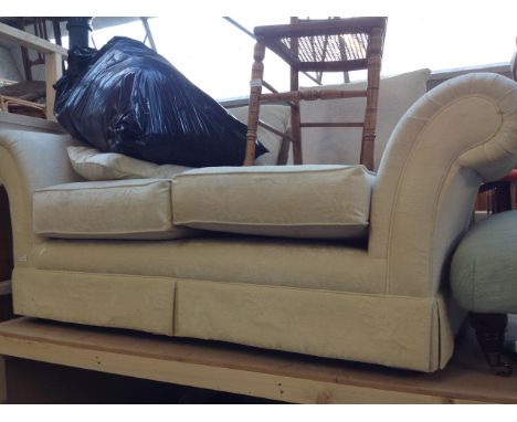 A CREAM 2 SEATER SOFA