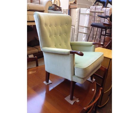 A RETRO BUTTON BACK ARMCHAIR