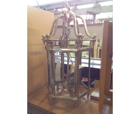 A BRASS LANTERN LIGHT FITTING