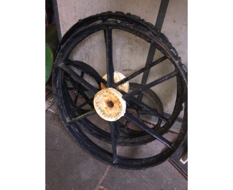 2 CAST IRON TRACTOR/WAGON WHEELS (6 SPOKE) AND 2 SMALL CAST IRON WHEELS