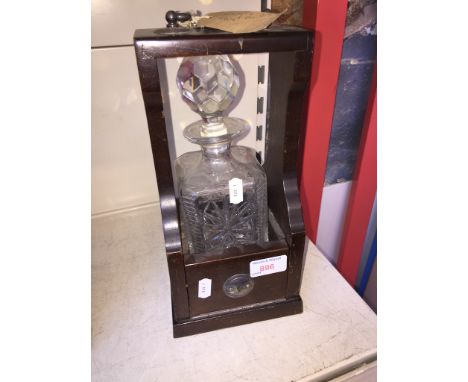 A SINGLE TANTALUS WITH DECANTER    L3