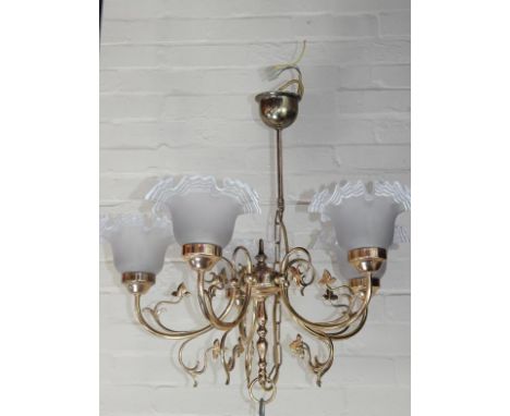 A brass five branch chandelier, with frosted frilled glass shades.
