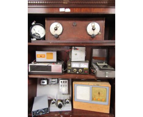 A Zetagi TM1000 power meter and antennae tuner, an oscillator tester, Sharp model RD-504 Solid State tape recorder, USSR comb