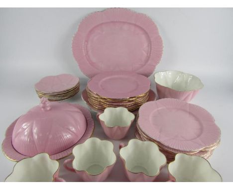 A Shelley pink ground porcelain fluted part tea service, comprising oval dish, muffin dish and cover, sugar bowl, five cups, 