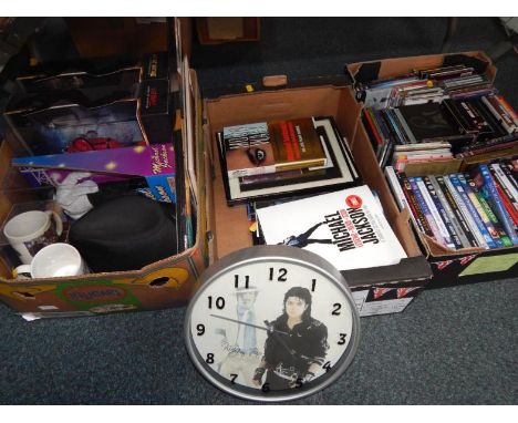 Michael Jackson collectables, including boxed dolls, books, mugs, DVDs, collector's plates and CDs.