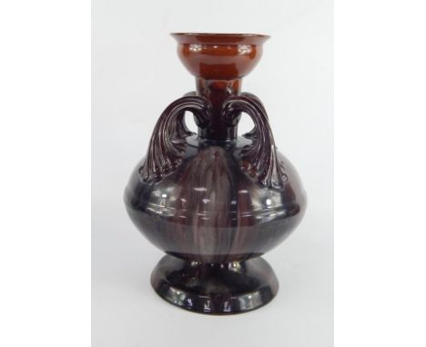 A Christopher Dressert for Linthorpe late 19thC pottery vase, of four fluted handle, baluster form, with a running brown glaz