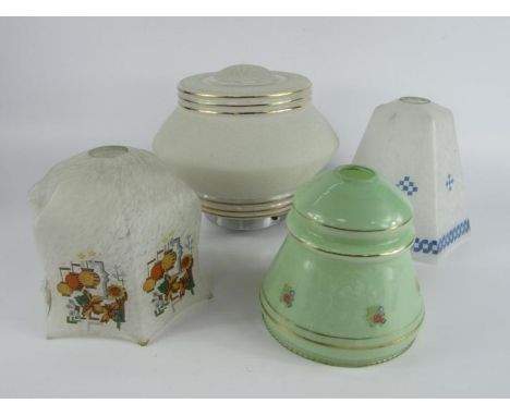 A 1940's textured glass ceiling light, and three glass lamp shades, variously decorated, (4).
