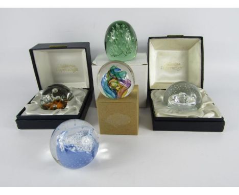 Two Caithness glass paperweights modelled as star watch and sea dance, boxed, a Selkirk paperweight, green glass dump weight 