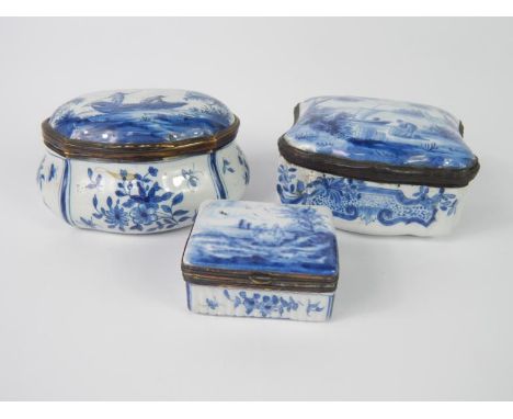 Two 18thC Dutch enamel boxes, one of bombe form painted with panels of flowers, fishermen to the lid, 11cm long, the other a 