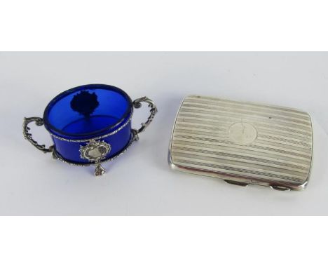 A George VI silver cigarette case, with engine turned decoration, Birmingham 1945, and a Continental white metal framed twin 