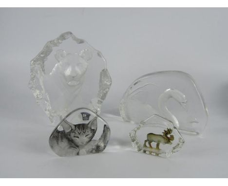 Two Mats Jonasson intaglio glass paperweights of a lioness and swan, for Maleras, Sweden, and two smaller of a reindeer and a