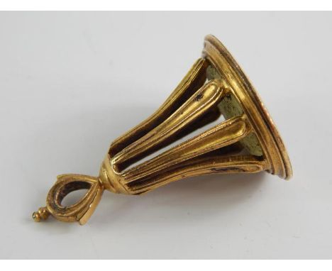 A Regency yellow metal and chalcedony seal, the oval stone intaglio carved with a Royal Coat of Arms, garter motto and corone