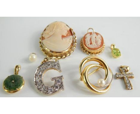 A group of yellow metal jewellery, comprising a cameo brooch, pendant, cultured pearl set brooch, peridot pendant, zircon set