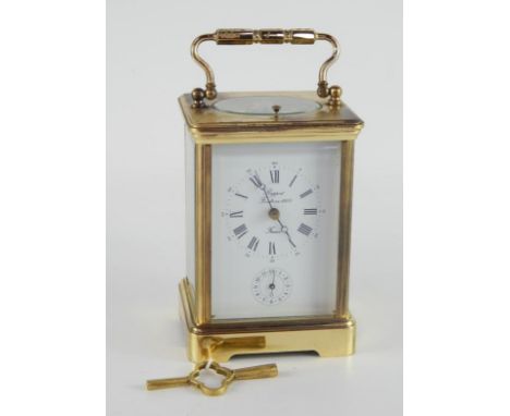 A French brass repeater carriage clock, enamel dial bearing Roman numerals, Rapport Fendee en 1900, subsidiary alarm dial, tw