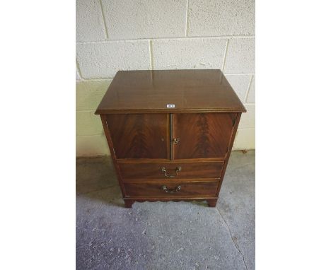 Georgian Mahogany Bedside Commode Cabinet, Having two doors above two drawers, 75cm high, 65cm wide, 47cm deep