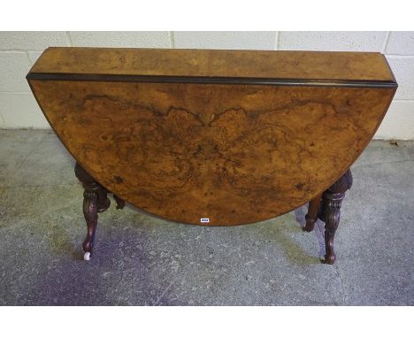 Victorian Burr Walnut Sutherland Table, Having drop leaves, raised on turned supports and scroll feet with ceramic castors, 7