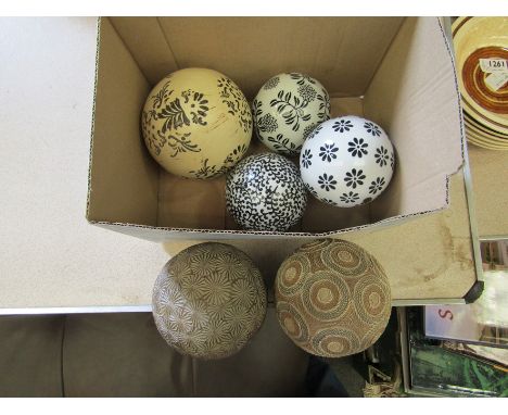 Six decorative balls including three ceramic