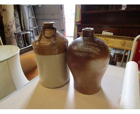 Two stoneware flagons: J.K. Fowler &amp; Son, Aylesbury and James Smith, Saint Mary Axe.  Tallest 32.5cm.  Some chips on rims