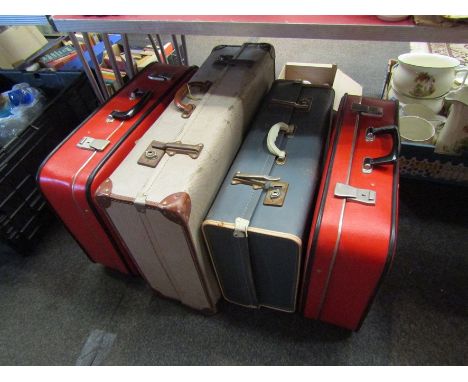 Four vintage suitcases