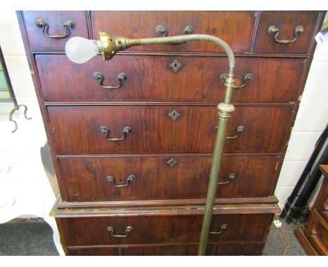 A late 19th Century brass standard lamp with flexible neck to glass shade