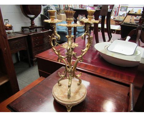 An ornate ormolu and onyx four sconce centre candlestick, 44cm tall