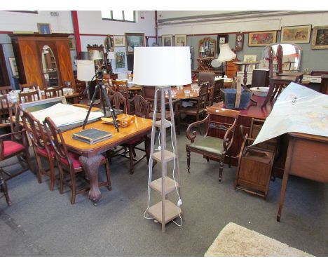 A modern limed oak effect standard lamp with shade