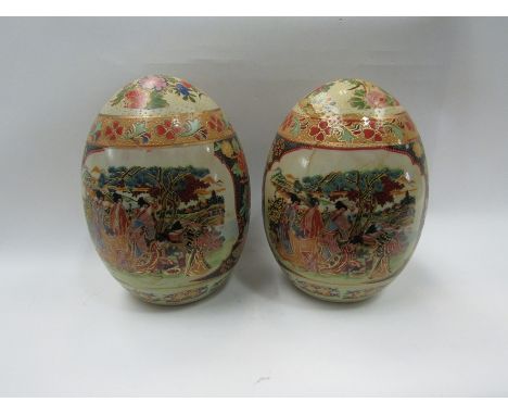 A pair of Oriental ceramic eggs, 15cm tall