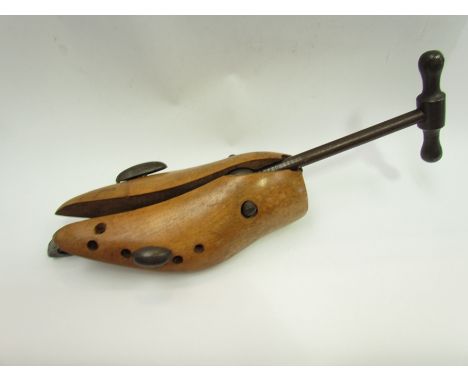 A vintage wood and steel shoe stretcher, size 6, circa 1910