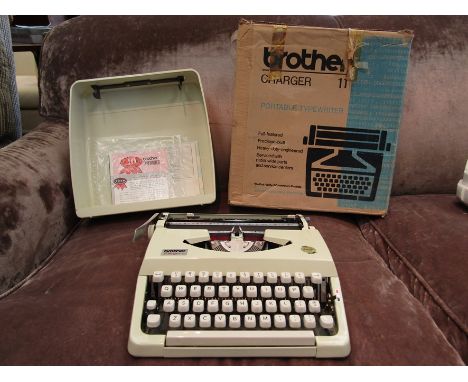 A boxed Brother portable typewriter