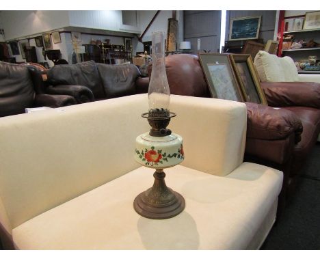 An oil lamp with a painted glass reservoir, brass base and glass chimney 