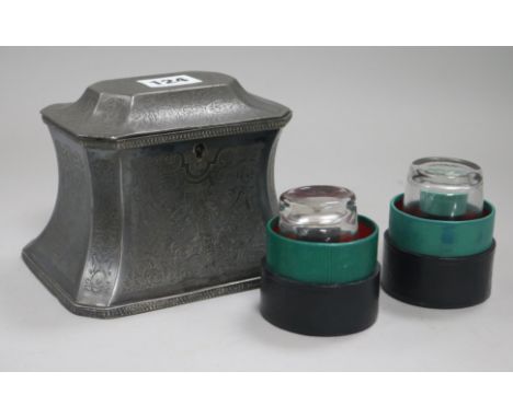 A Britannia metal tea caddy and two leather cased measures