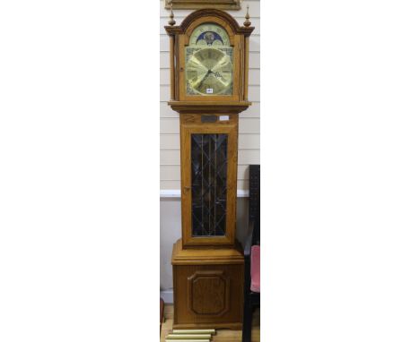 A modern oak cased eight day longcase clock