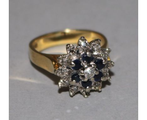 An 18ct gold, sapphire and diamond cluster ring, size I.