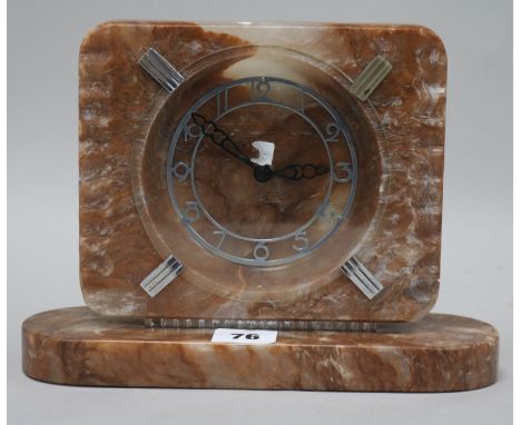 An Art Deco onyx and diamond mantel clock