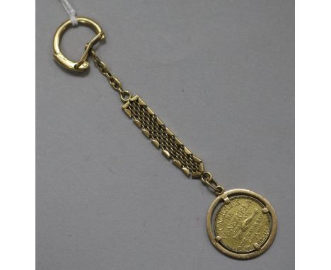 A Caciques de Venezuala Guaicaipuro 1957 gold coin, mounted on an 18ct gold key ring, gross 15.5 grams.