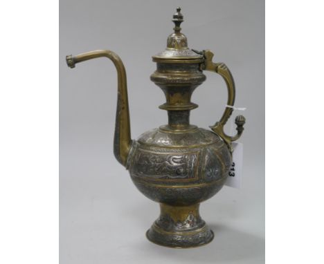 A 19th century Islamic mixed metal and bronze coffee pot
