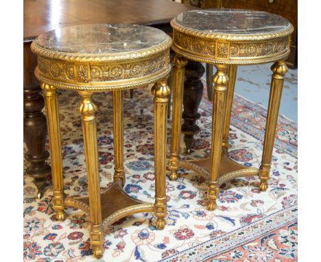 LAMP TABLES, a pair, Louis XVI style with circular marble tops on gilt bases, 49cm x 80cm H. (2)