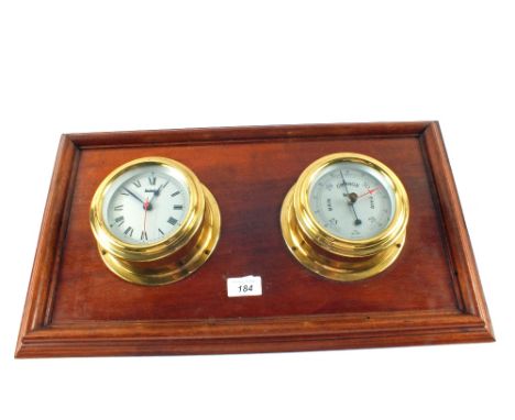 A Sestrel ships clock and barometer mounted on an Oak board