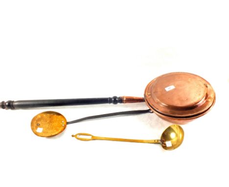 A Victorian warming pan, brass ladle and a brass skimmer