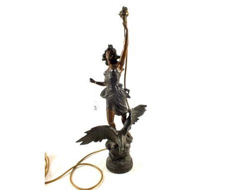 A French spelter table lamp of a lady with torch on eagle