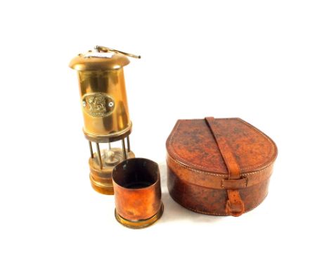 A Welsh Brass miners lamp, shell case ornament and a leather collar box