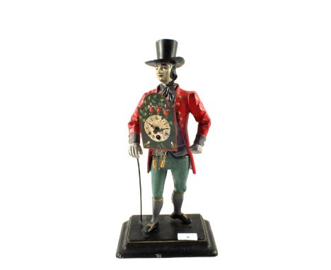 A reproduction cast metal clock in the form of a clock seller