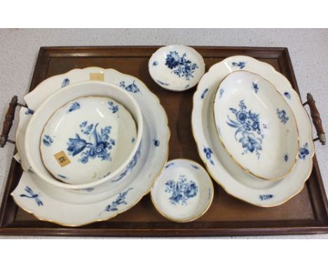 Seven pieces of Meissen blue and white porcelain with floral and insect decoration comprising of two oval dishes, a pie dish,