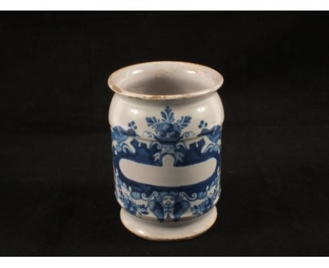 An 18th Century Delft blue and white drug jar with a blank cartouche, song birds and winged cherub, height 5"