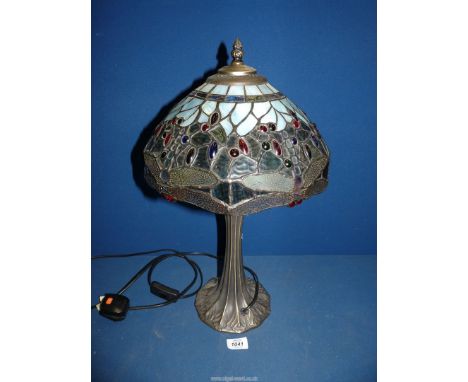A Tiffany style lamp in blues and greens with dragonfly pattern shade, 20" tall.